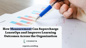 picture of a pen pointing at charts and graphs for measurement with the title of the blog post "How Measurement Can Supercharge LearnOps and Improve Learning Outcomes Across the Organization"