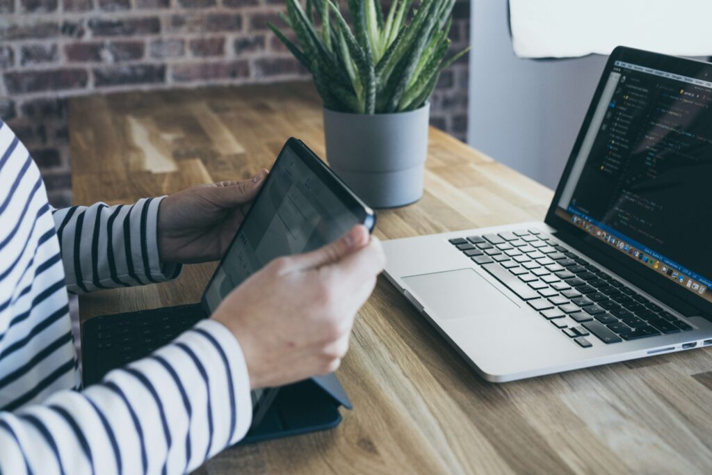 woman working remotely at her laptop in a well lit office