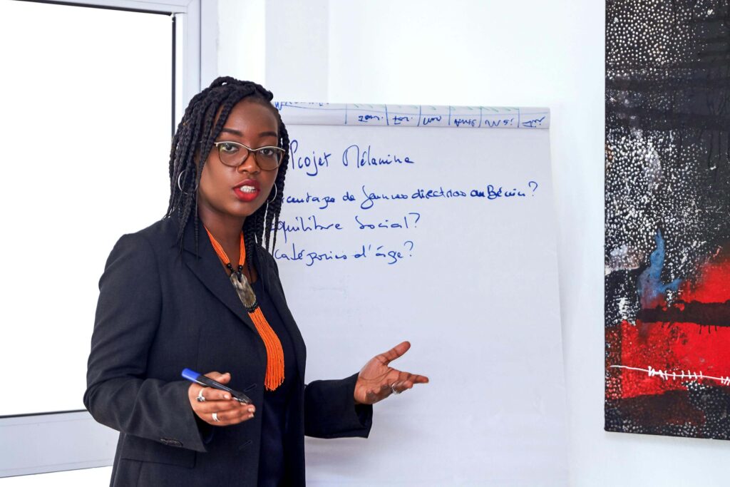 woman in suit at a notepad leading a training session